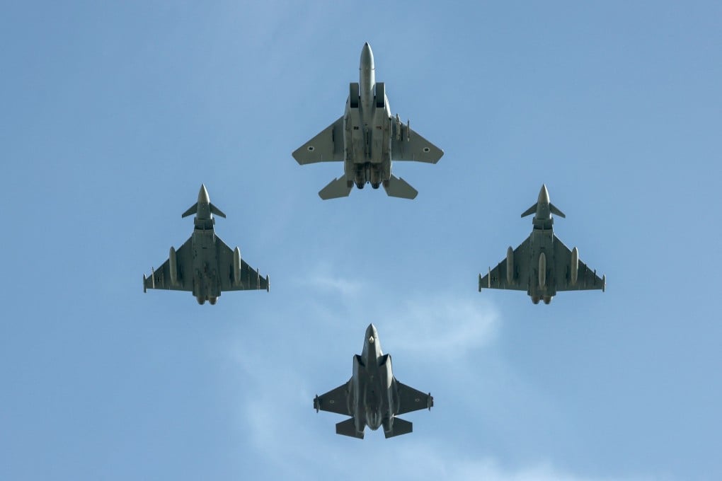 Israeli and German fighter jets fly over the Knesset, Israel’s parliament, during a fly-by in a display of cooperation between the two countries in Jerusalem on Sunday. Photo: AFP