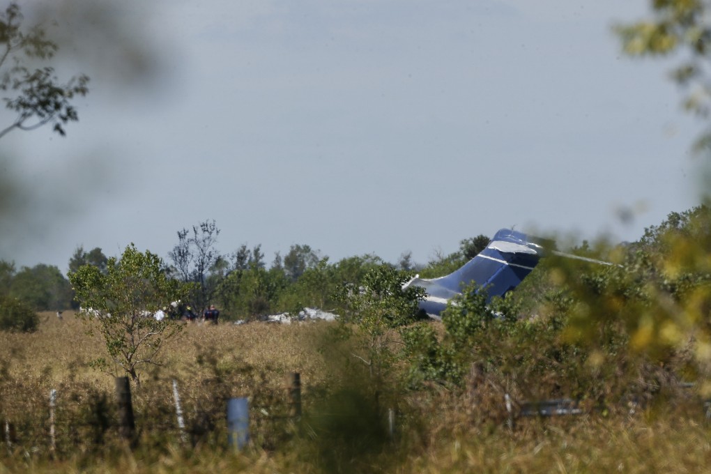 Remnants of an aircraft can be seen at the site of crash in Brookshire, Texas, on Tuesday. Photo: Houston Chronicle via AP