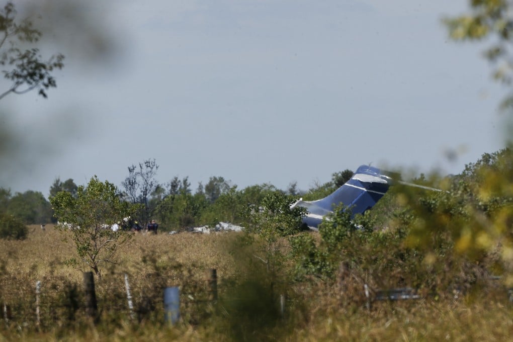 Remnants of an aircraft can be seen at the site of crash in Brookshire, Texas, on Tuesday. Photo: Houston Chronicle via AP