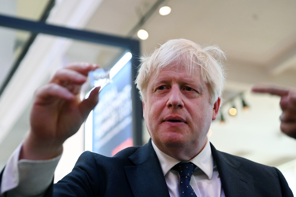 British Prime Minister Boris Johnson looks at new technologies during the Global Investment Summit 2021 at the Science Museum in London on Tuesday. Photo: EPA-EFE