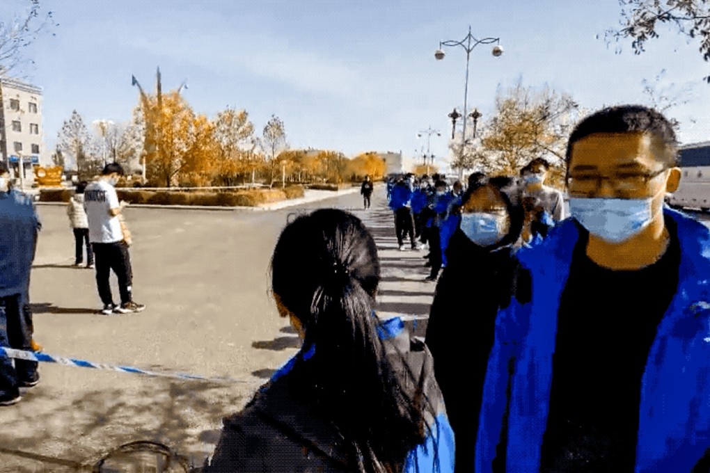 Members of the testing team for China’s Kuaizhou 1A orbital launch rocket queue for Covid-19 tests. Photo: Handout