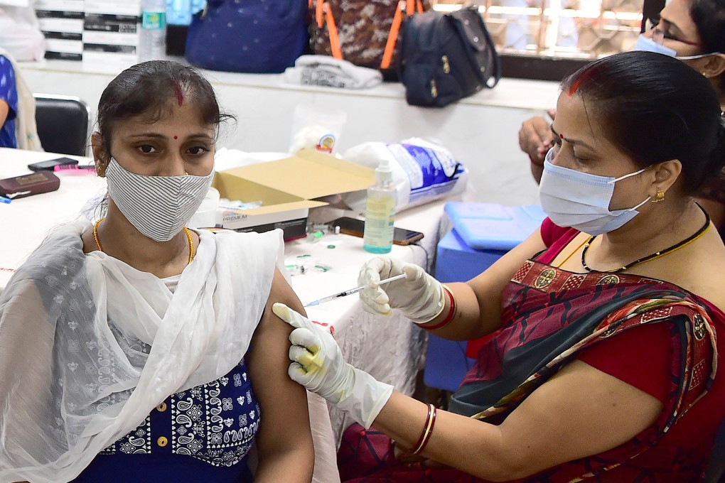 A woman receives a dose of the Covishield vaccine in Allahabad. Photo: AFP