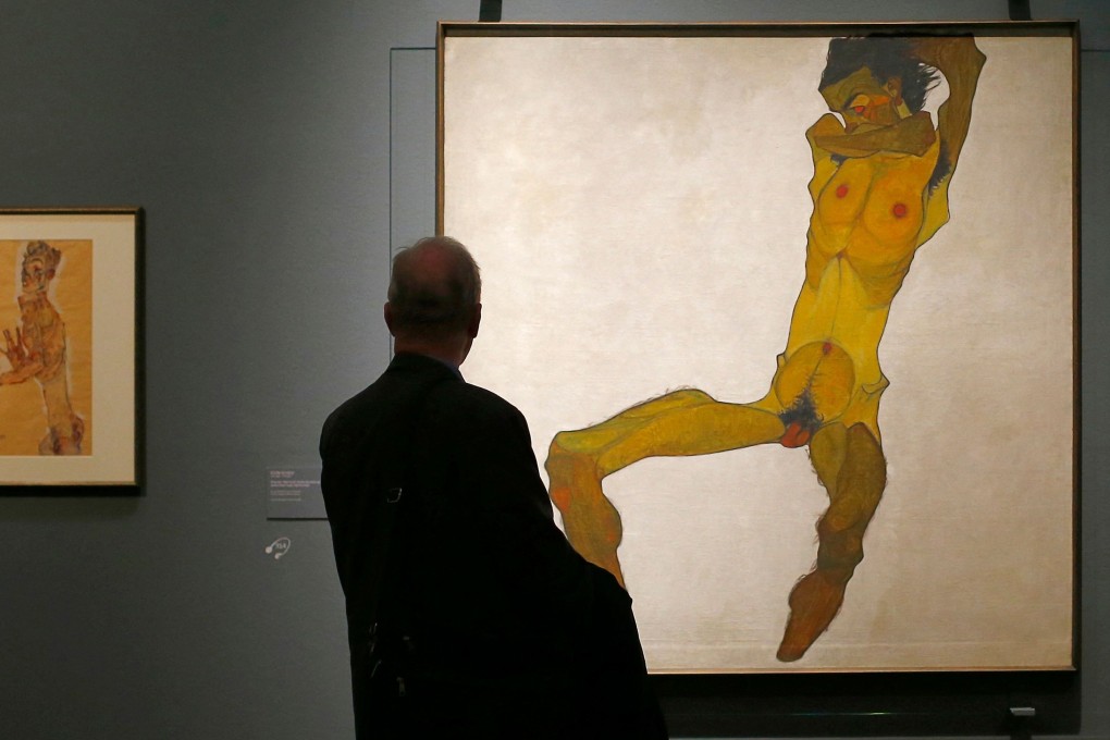 A man looks at Seated Man, by Austrian artist Egon Schiele, at an exhibition at the Leopold Museum in Vienna in October 2018. Photo: AFP