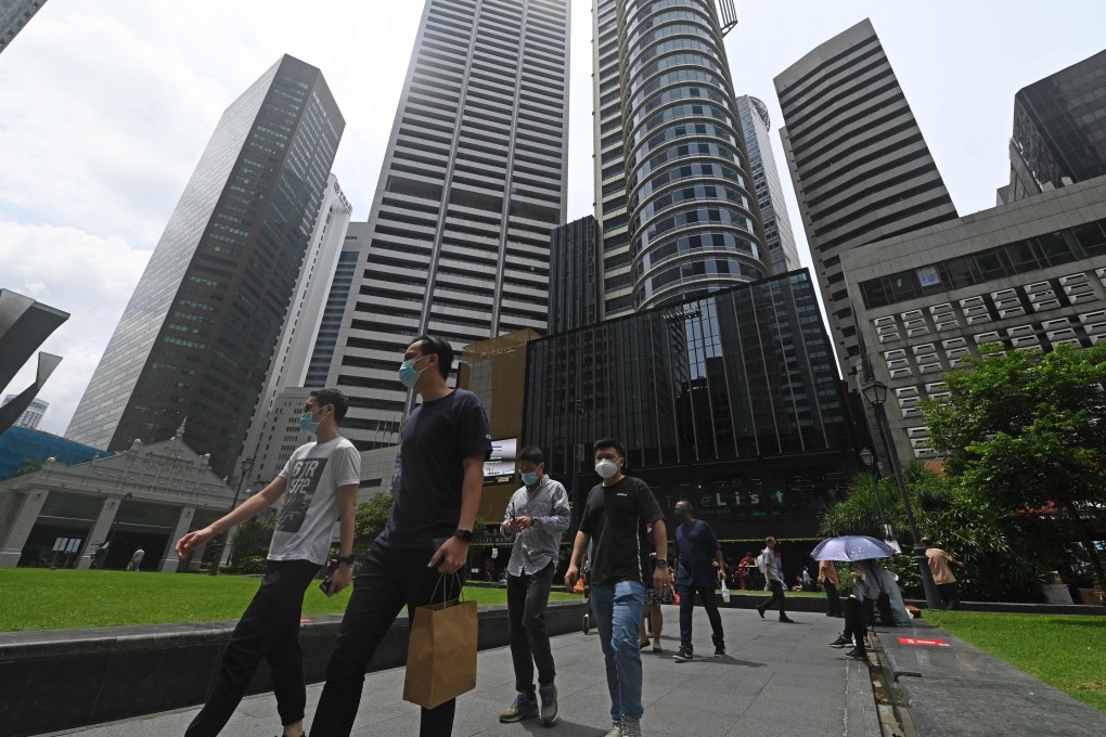 Office workers seen during their lunch break at Raffles Place financial business district in Singapore. Photo: AFP