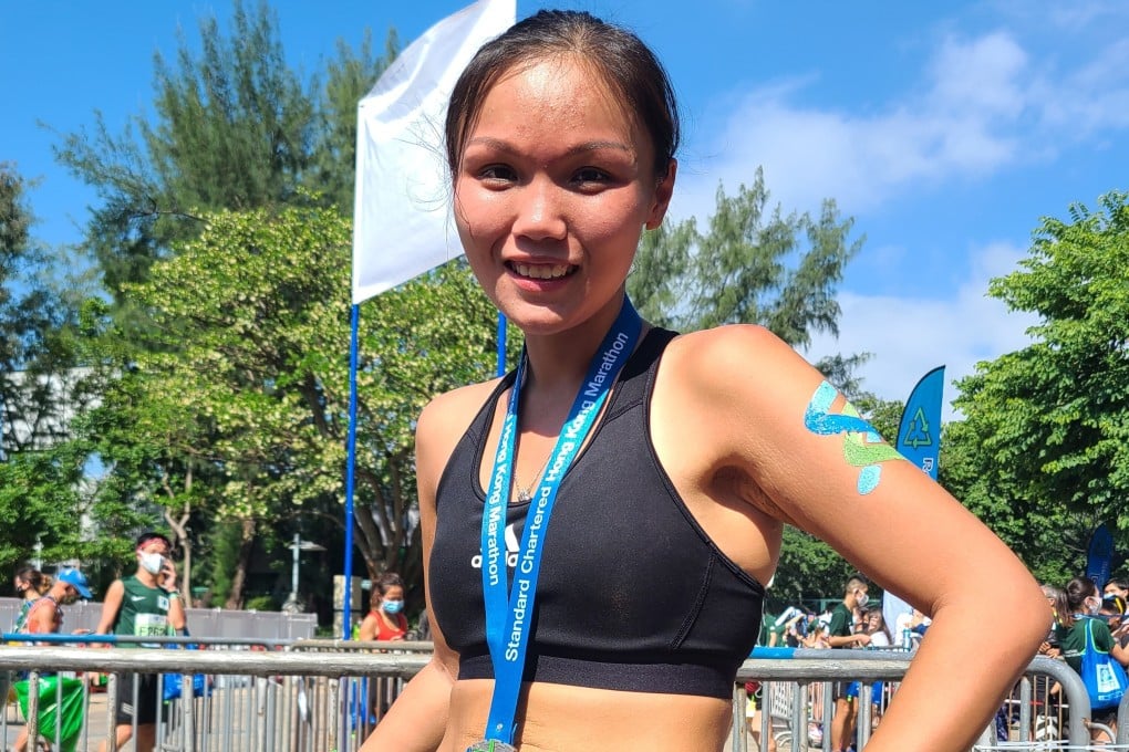 Hong Kong Marathon finisher Serene Yu said it felt really great to compete in a race with other people again and was so excited she had her friend paint the Hong Kong flag on her leg. Photo: Patrick Blennerhassett