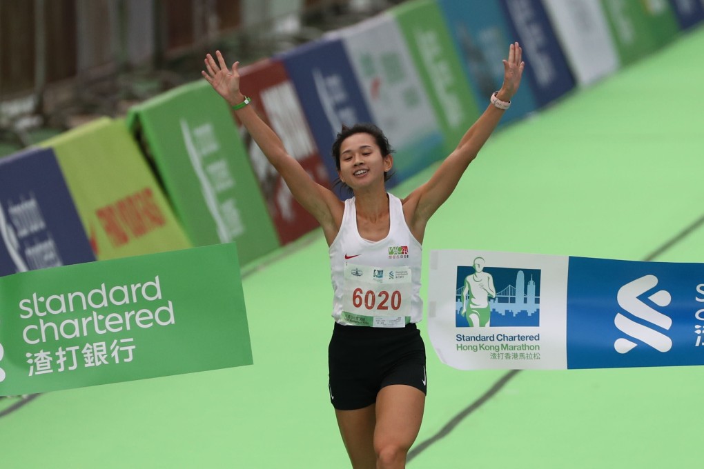 Crystal Vut Tsz-ying crosses the finish line at Victoria Park to win the 2021 women's Hong Kong Half Marathon. Photo: Nora Tam