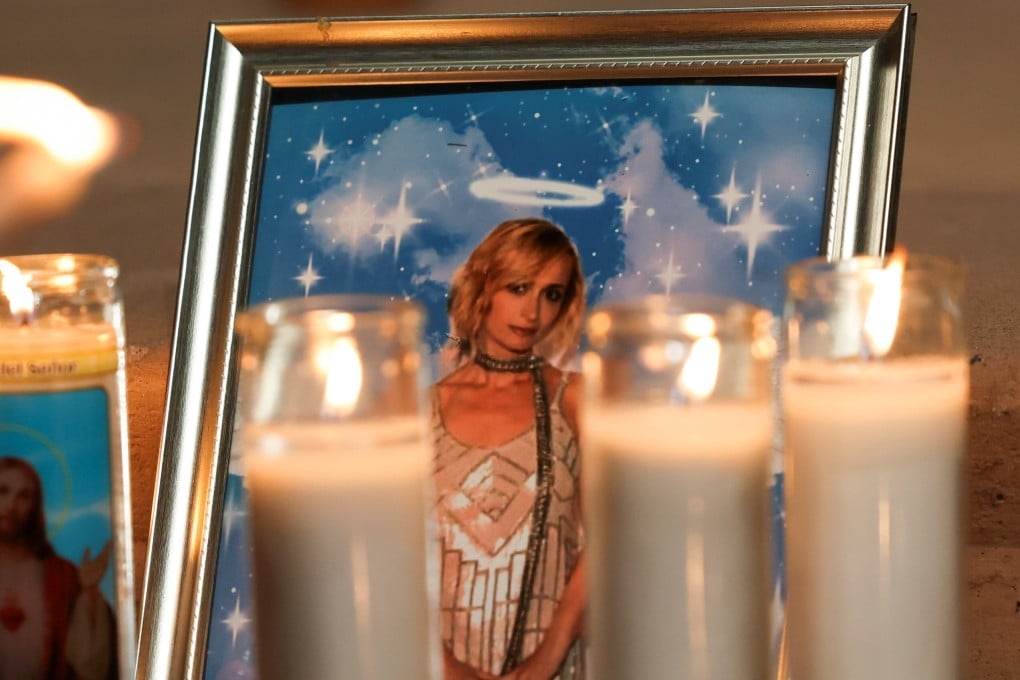 A photo of Halyna Hutchins rests among candles at a vigil in Albuquerque. Photo: Reuters