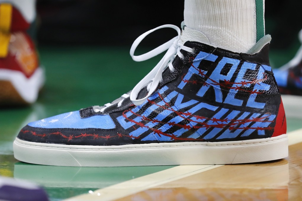 Boston Celtics' Enes Kanter wears shoes with the message ‘Free Uygur’ ahead of an NBA game against the Toronto Raptors in Boston. Photo: AP