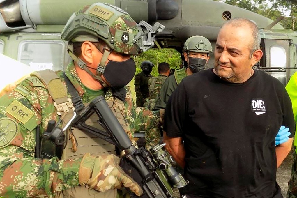Dairo Antonio Usuga is escorted by the Colombian military after being captured in Turbo on October 23, 2021. Photo: Colombian Defence Ministry via Reuters
