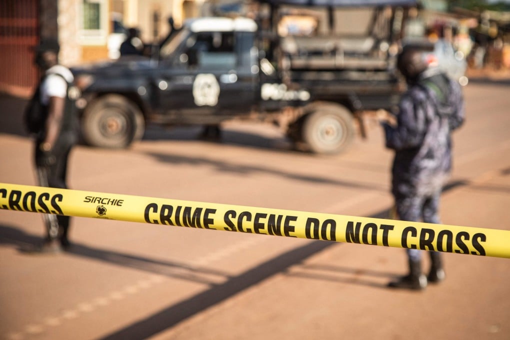 Ugandan police secure the crime scene on Sunday following a bomb blast in capital Kampala. Photo: AFP