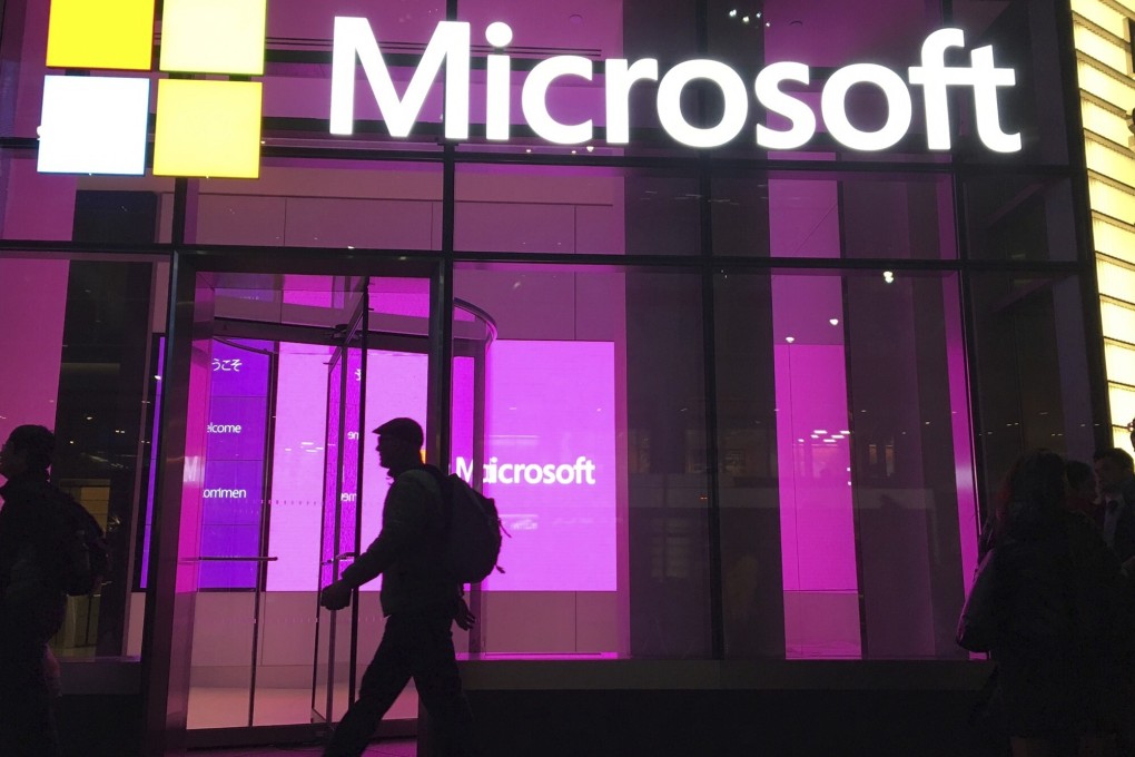 People walk past a Microsoft office in New York. Photo: AP