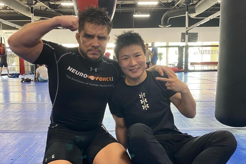 Henry Cejudo (left) poses with Zhang Weili on the mats at the Fight Ready gym in Scottsdale, Arizona. Photo: Instagram/@henry_cejudo