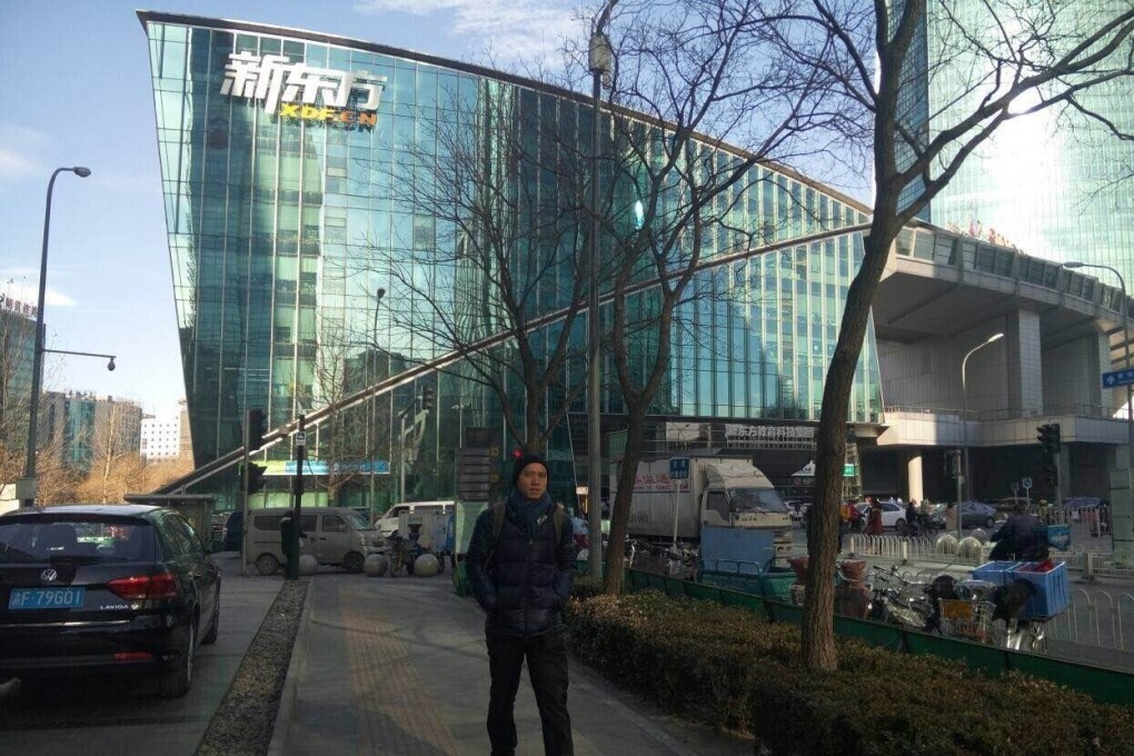 A man walks in front of the New Oriental Education headquarters in Beijing. Photo: Wikipedia