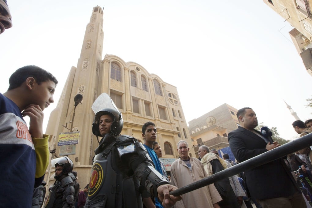 Police surround Mar Mina church in Cairo, Egypt in December 2017, after a deadly shoot-out outside the church. Photo: AP