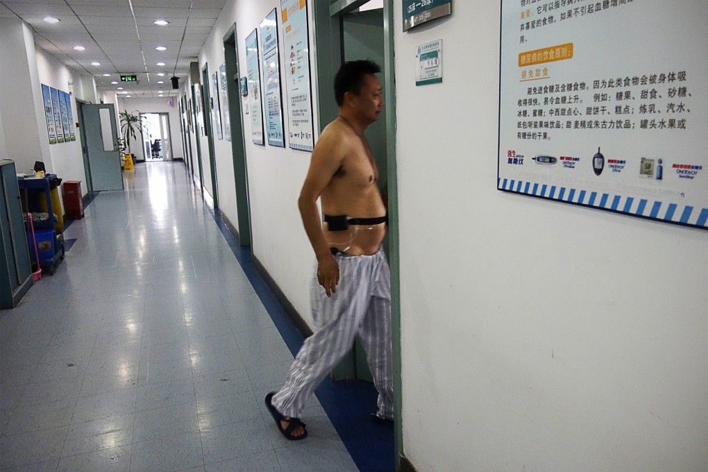 A patient walks into a ward at a diabetes hospital in Beijing. The disease in China is most common among the wealthy. Photo: AFP
