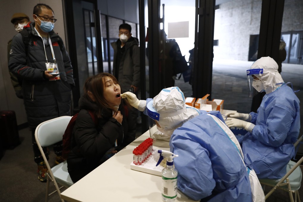 A member of the media is tested for the Covid-19 at an Olympic test event in China. Photo: Reuters
