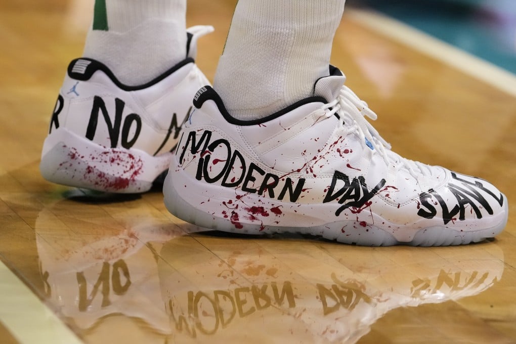 Boston Celtics centre Enes Kanter wearing “modern day slavery” shoes during his team’s game against the Charlotte Hornets and calls out Nike and China in social media video. Photo: USA TODAY Sports