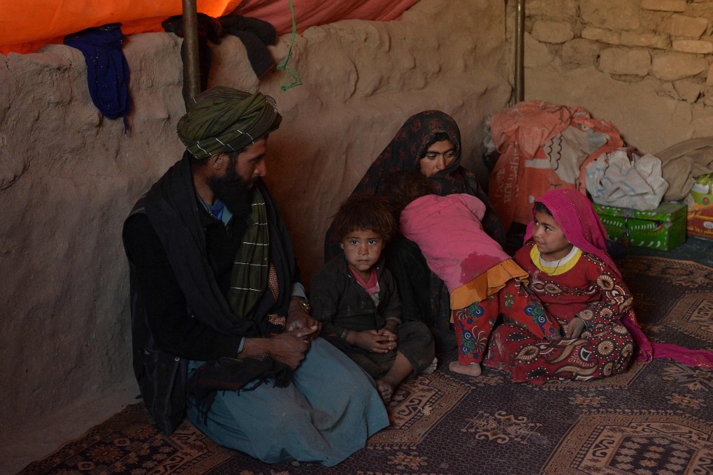 Afghan mother Fahima with her children Faristeh (right) and Shokriya (centre) at a displaced people’s camp in Qala-i-Naw, Badghis .Photo: AFP