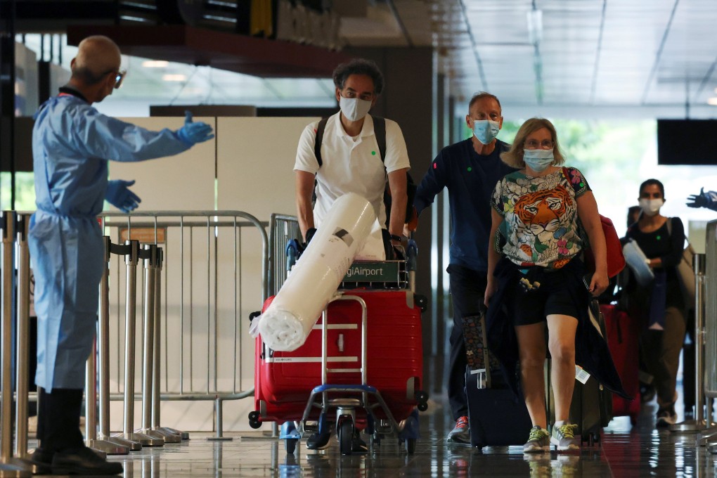 Passengers from Amsterdam arrive at Changi Airport on October 20, 2021. Photo: Reuters
