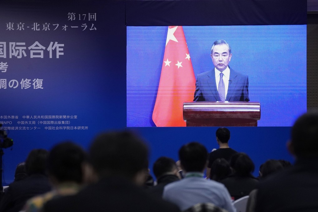 Chinese Foreign Minister Wang Yi speaks on screen during the Tokyo-Beijing Forum on Monday. Next year, China and Japan will mark the 50th anniversary of the normalisation of bilateral diplomatic ties. Photo: Kyodo