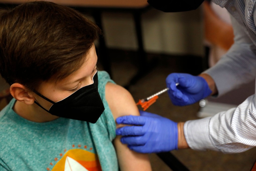 A young patient receives the Pfizer Covid-19 vaccine in Michigan in May. Photo: AFP