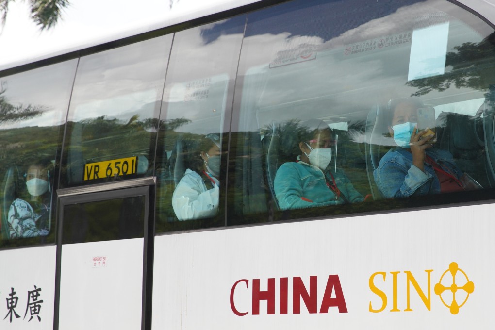 Newly arrived Hong Kong domestic helpers are taken by bus to their designated quarantine facility. Photo: Winson Wong