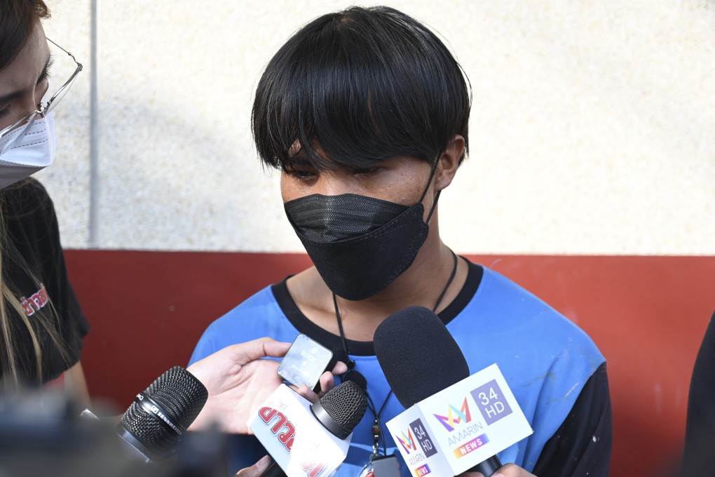 One of the painters, a Myanmar national identified as Song, talks to reporters at Pak Kret police station on Wednesday. Photo: AP