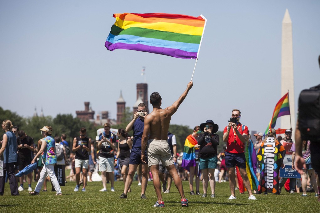 A demonstrator waves a rainbow flag on the National Mall during the Equality March for Unity and Peace in Washington in June 2017. Photo: AFP