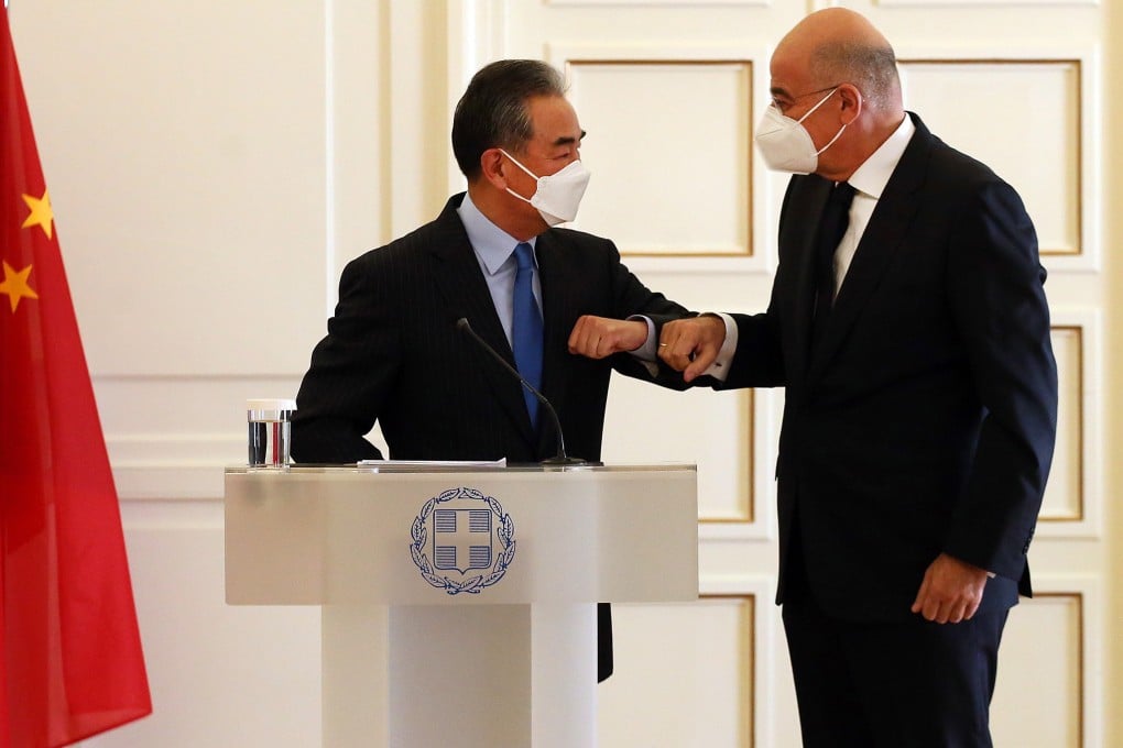 Foreign Minister Wang Yi is greeted in Athens by his Greek counterpart Nikos Dendias. Photo: EPA-EFE