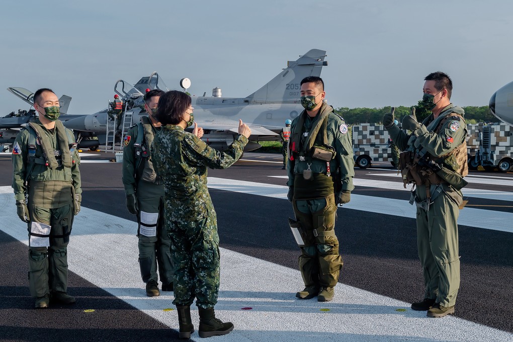 Taiwan officials have downplayed remarks by President Tsai Ing-wen (centre) confirming the presence of US military personnel on the island. Photo: AP