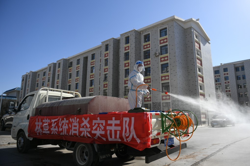 Workers disinfect a residential area in Ejina Banner, Inner Mongolia, on Wednesday as part of efforts to contain a coronavirus outbreak. Photo: Xinhua