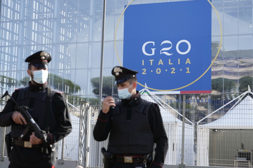 Italian police officers patrol in front of the Rome convention centre where the G20 meetings will take place starting on Saturday. Photo: AP