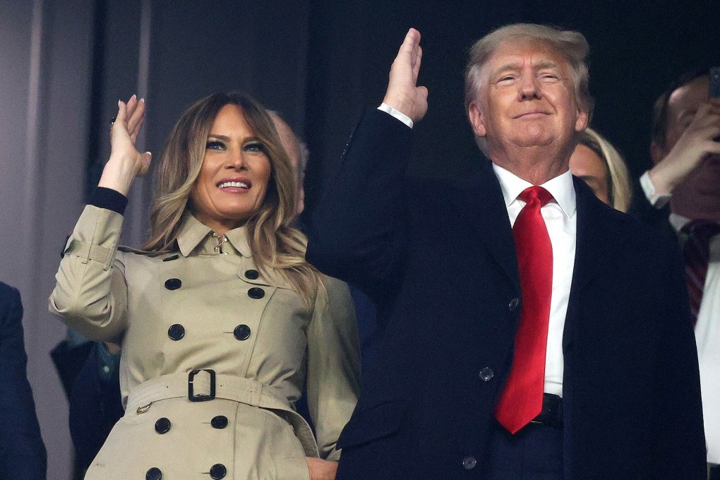 Former US first lady Melania Trump and former president Donald Trump do the controversial ‘Tomahawk Chop’ before game four of the World Series between the Houston Astros and the Atlanta Braves at Truist Park on Saturday. Photo: TNS
