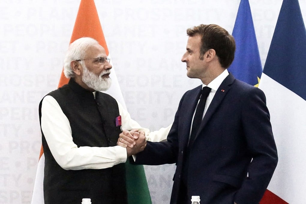 Indian Prime Minister Narendra Modi shakes hands with French President Emmanuel Macron during a bilateral meeting at the G20 leaders’ summit in Rome on Friday. Photo: AFP