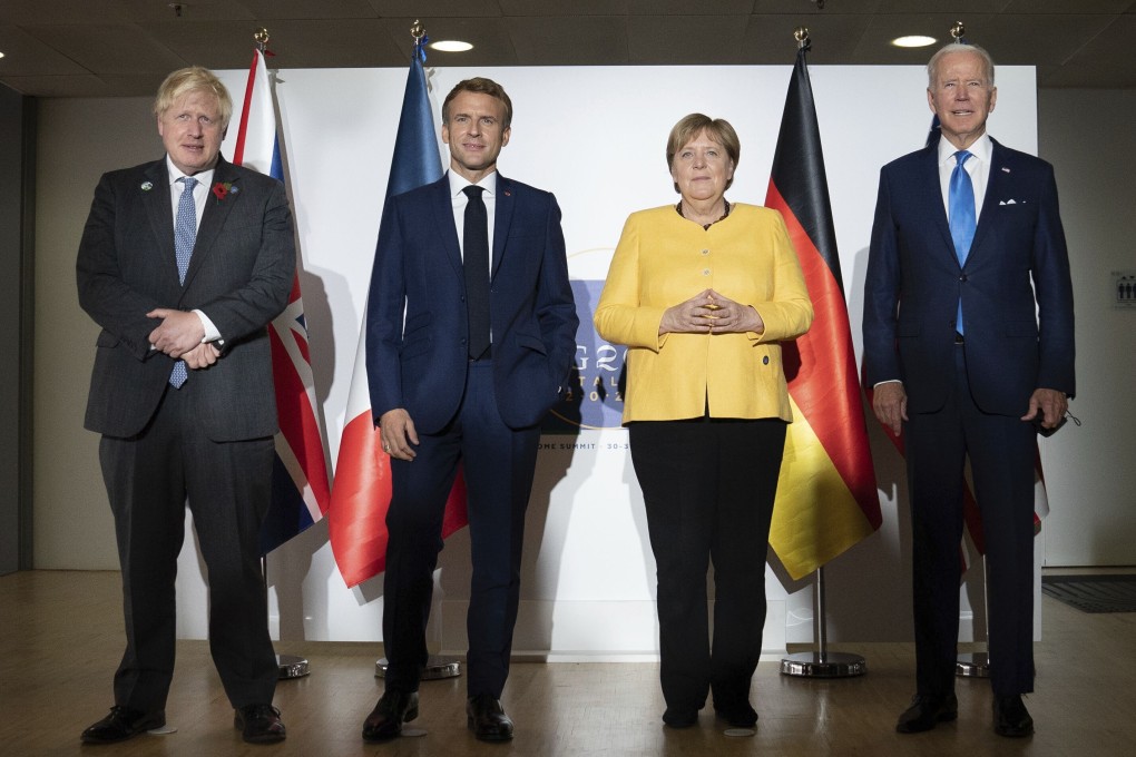 British Prime Minister Boris Johnson, French President Emmanuel Macron, German Chancellor Angela Merkel and US President Joe Biden are seen at the G20 summit in Rome. Photo: AP