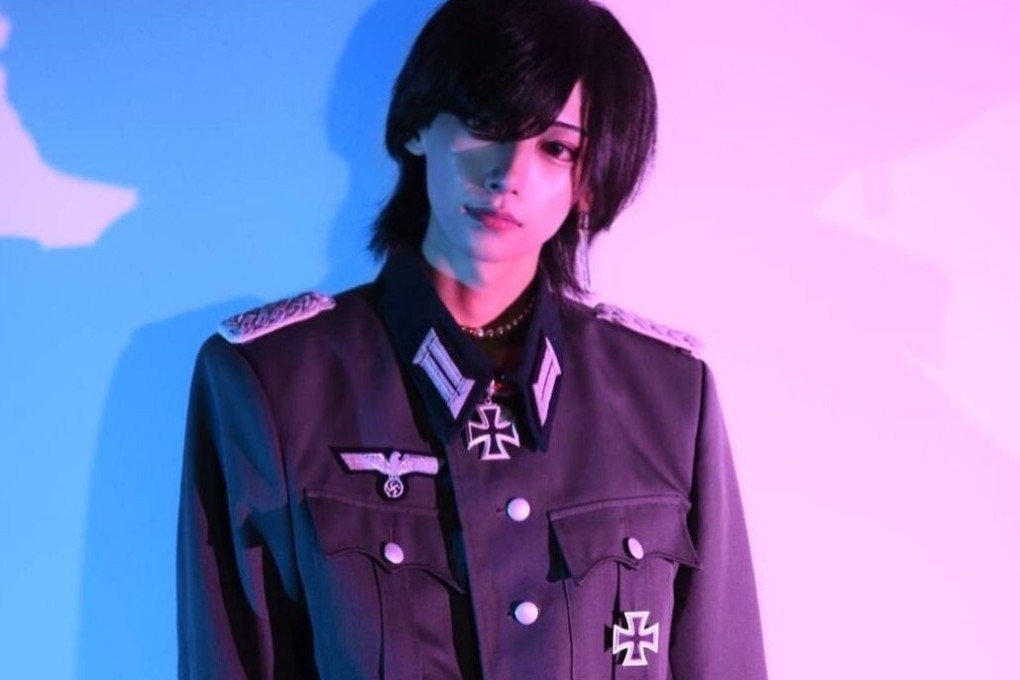 A worker at the ‘Unfair’ bar dressed in a Nazi uniform. Photo: Instagram