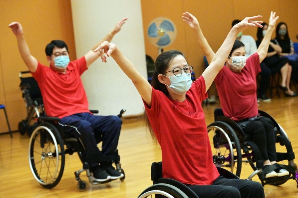 Olivia Chung (centre) is a member of the Hong Kong Rehabilitation Power Chinese Orchestra. Photo: SCMP