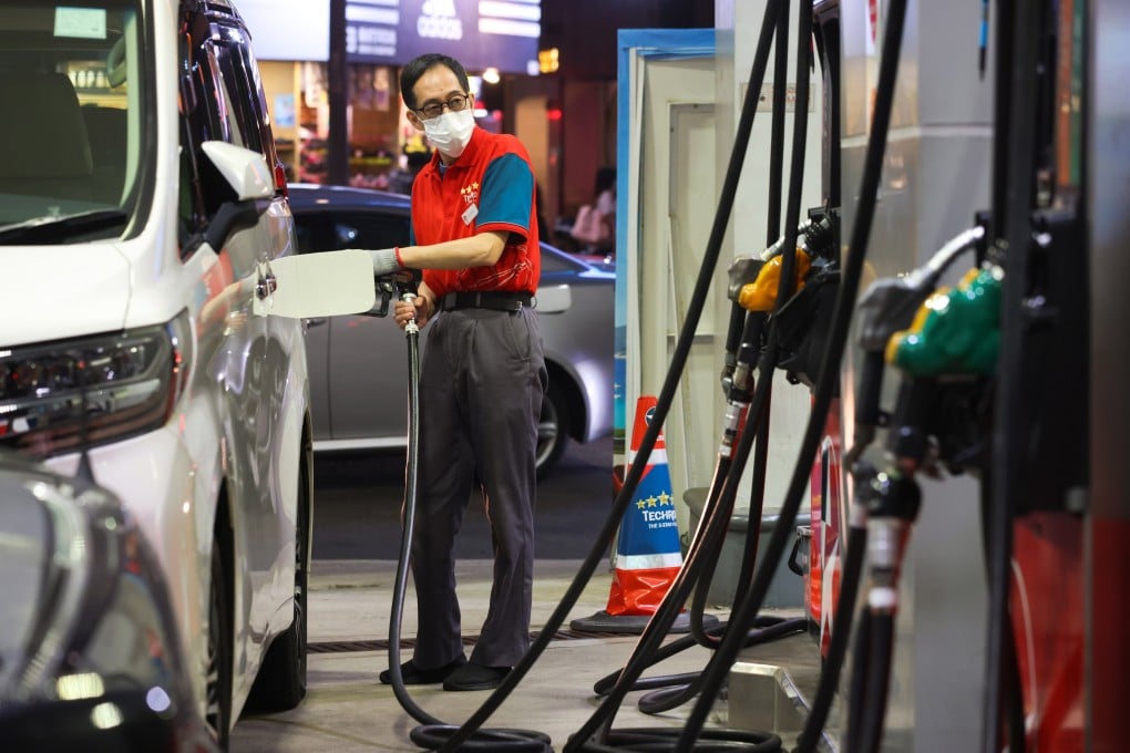 A Caltex petrol station employee fuels a customer’s car in Wan Chai. Photo: Dickson Lee