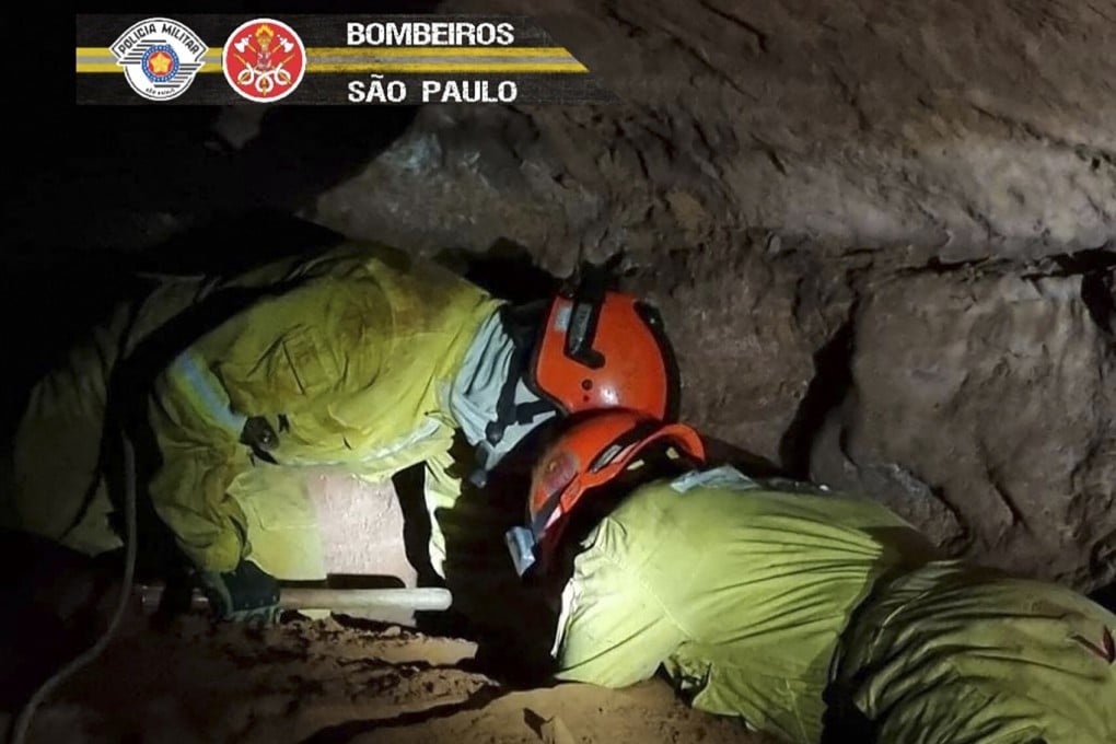 Firefighters work to rescue civilian firefighters buried in a cave after a collapse in Altinopolis, Sao Paulo, Brazil on Sunday. Photo: Sao Paulo State’s Military Police / AFP