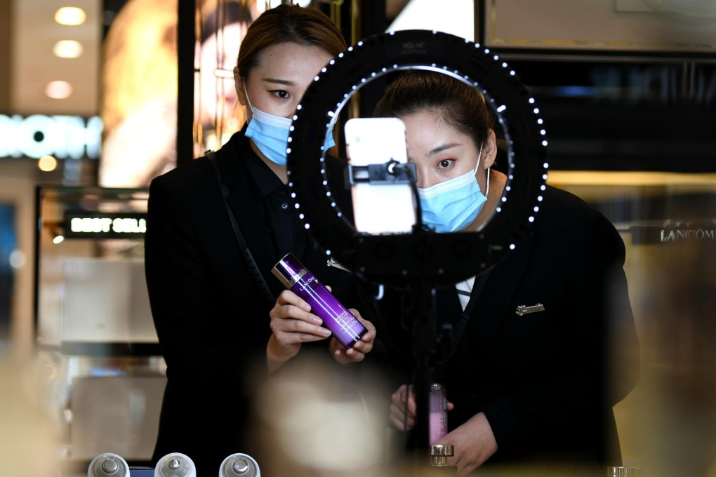 Saleswomen use live-streamed marketing campaigns to help drive demand for cosmetic products at a shopping centre in northern China’s Hebei province. Photo: Xinhua