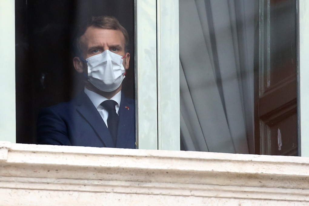Emmanuel Macron, France's president, looks out from a window before a G20 leaders visit to the Trevi fountain in Rome, Italy. Photo: Bloomberg