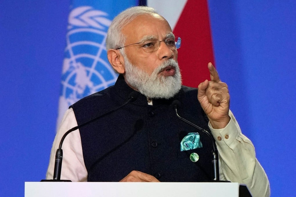 India's Prime Minister Narendra Modi presents his national statement as part of the World Leaders' Summit of the COP26 UN Climate Change Conference in Glasgow, on Monday. Photo: AFP