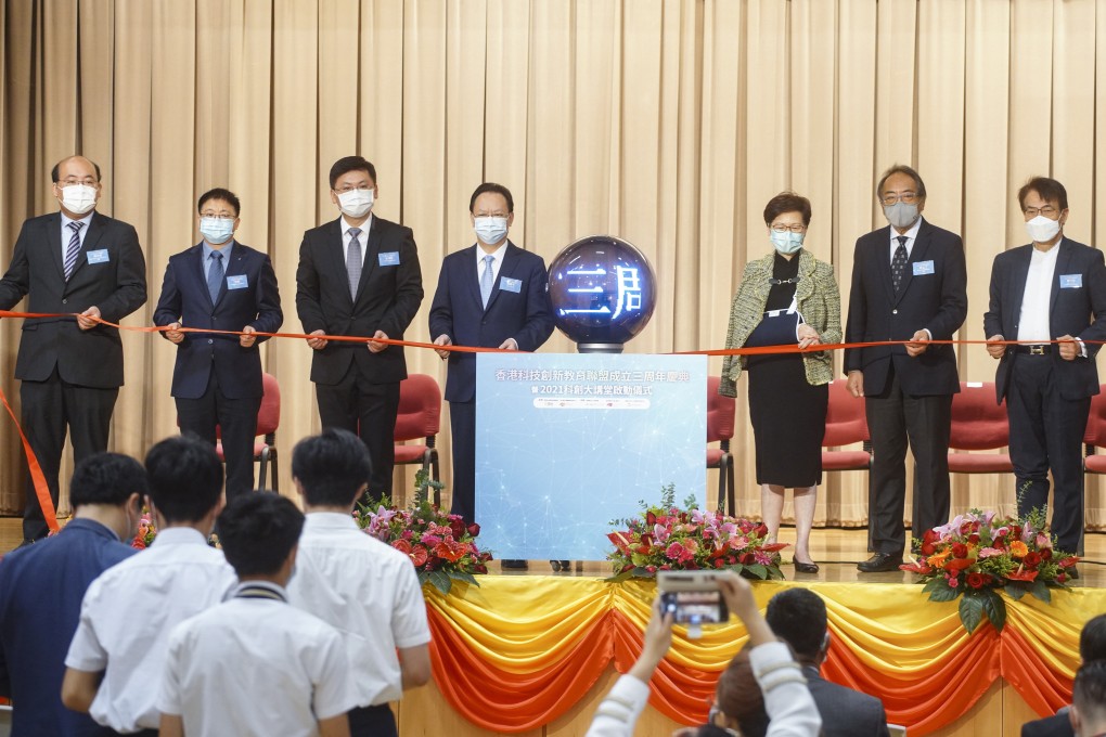 Hong Kong leader Carrie Lam (in green jacket) with members of the liaison office and STEM Education Alliance at the opening ceremony of the talks on Tuesday. Photo: Winson Wong