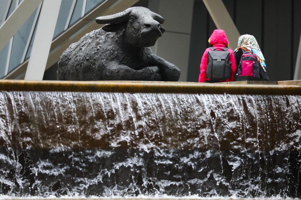 A bull sculpture seen outside the Exchange Square in Central. Hong Kong. Sentiment improves following overnight gains in US equities and Chinese ADRs. Photo: Dickson Lee