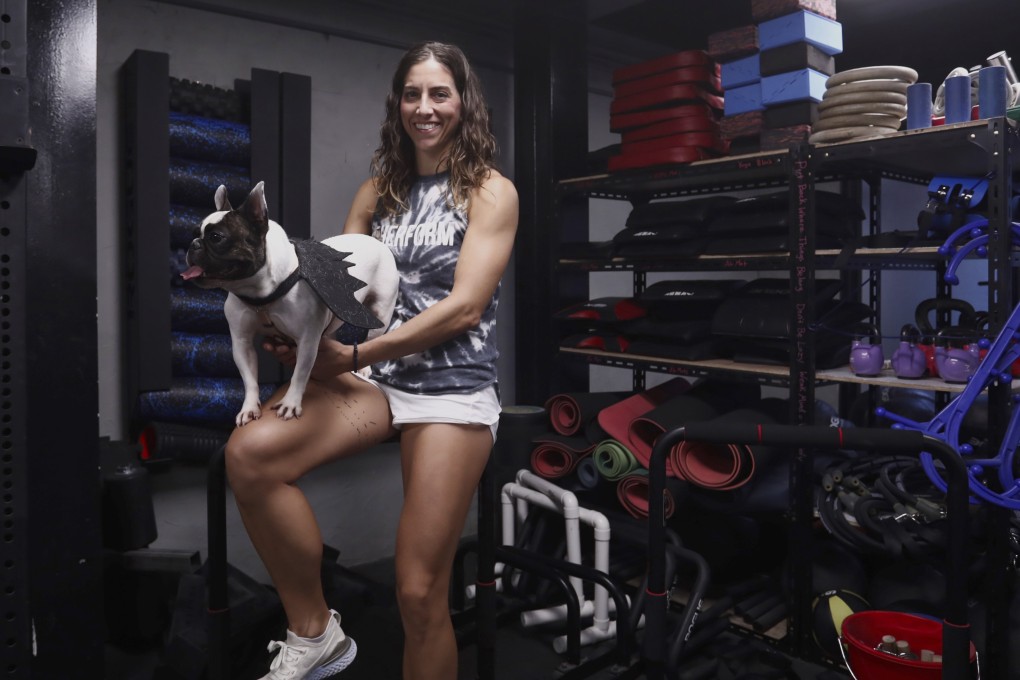 Stephanie Poelman with her French Bulldog Dela, who she got from the Animal Friends organisation in Hong Kong. Photo: Jonathan Wong