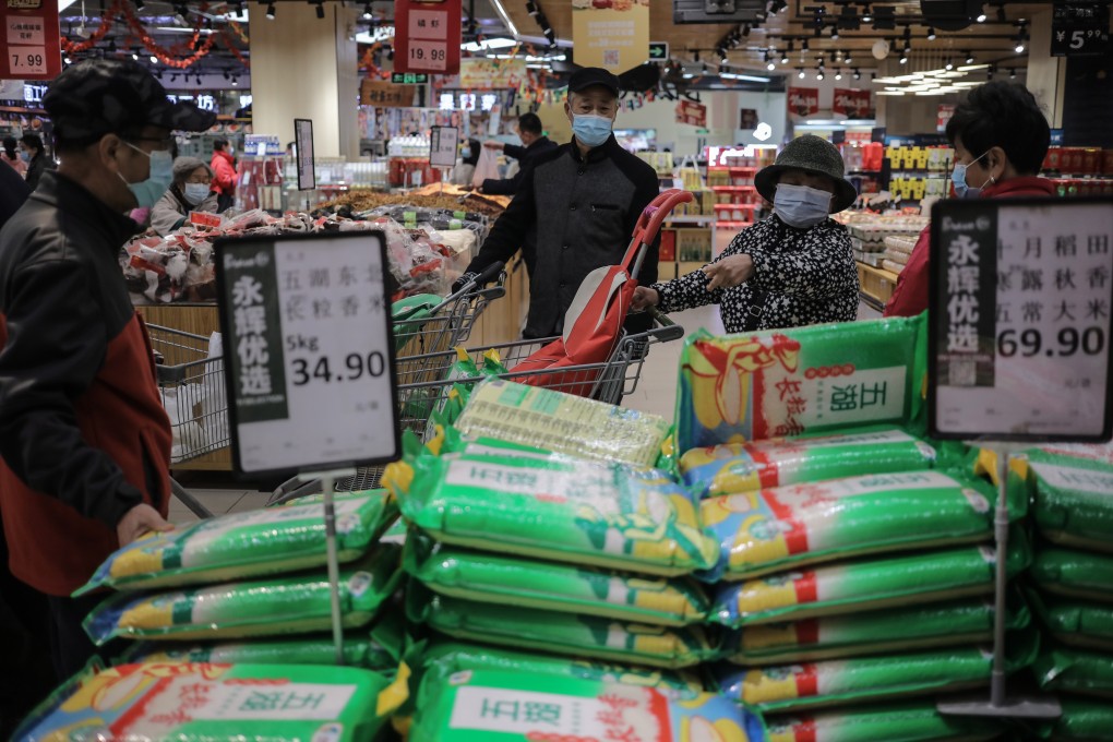 Supermarket shoppers are pictured in Beijing on November 2. China’s Ministry of Commerce told families to keep daily necessities in stock in case of emergency after Covid-19 outbreaks and unusually heavy rain. Photo: EPA-EFE