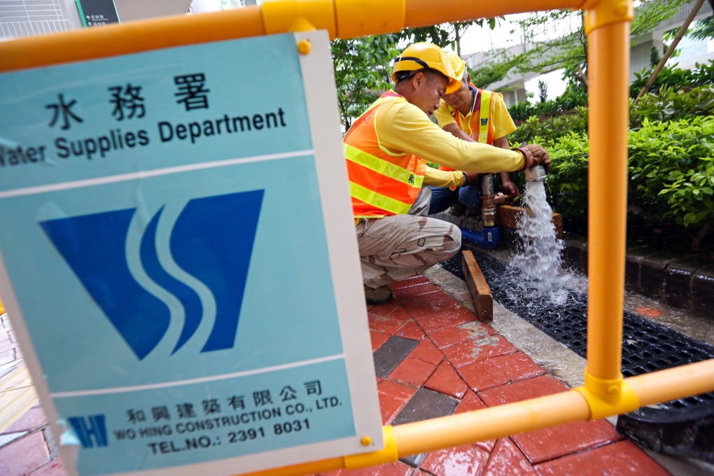 Water Supplies Department workers take samples for testing. Photo: Nora Tam