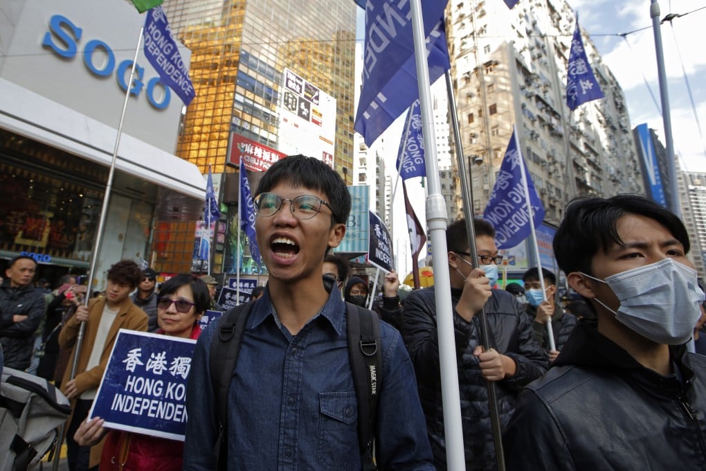 Tony Chung (left) pictured at a New Year’s Day protest in 2019. Photo: AP