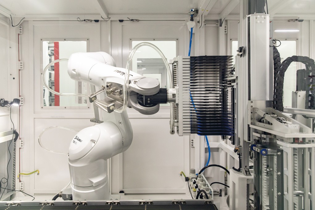 A robotic arm operates on the photovoltaic cell production line at the LONGi Green Energy Technology plant in Xi'an, Shaanxi Province, China. Photo: Bloomberg
