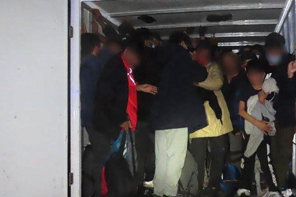 A group of migrants smuggled in a truck at an unknown location. Photo: Europol /AFP